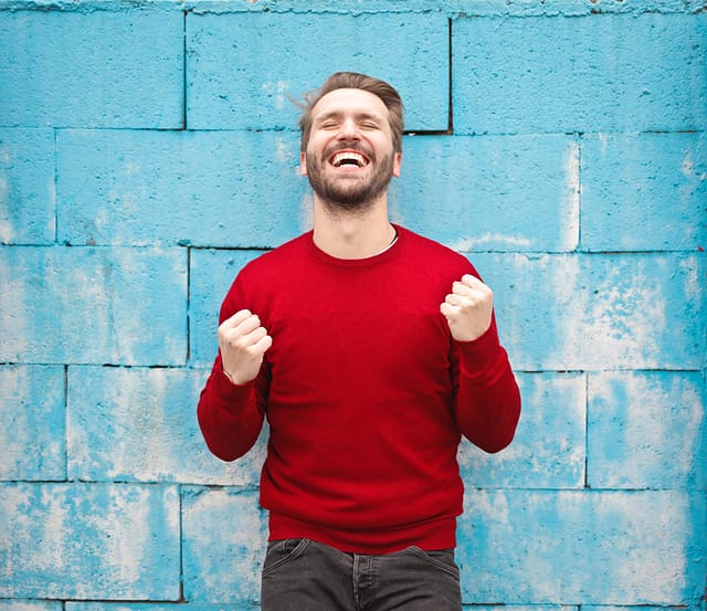 a man wearing red sweater